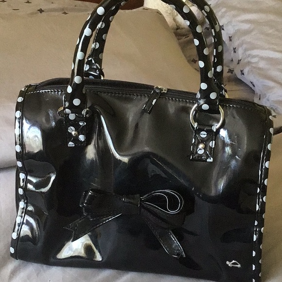 Carpisa Handbags - Patent black new bag with polka dot trim detail